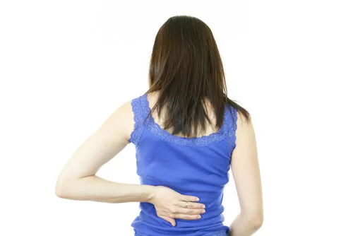 back pain female blue shirt